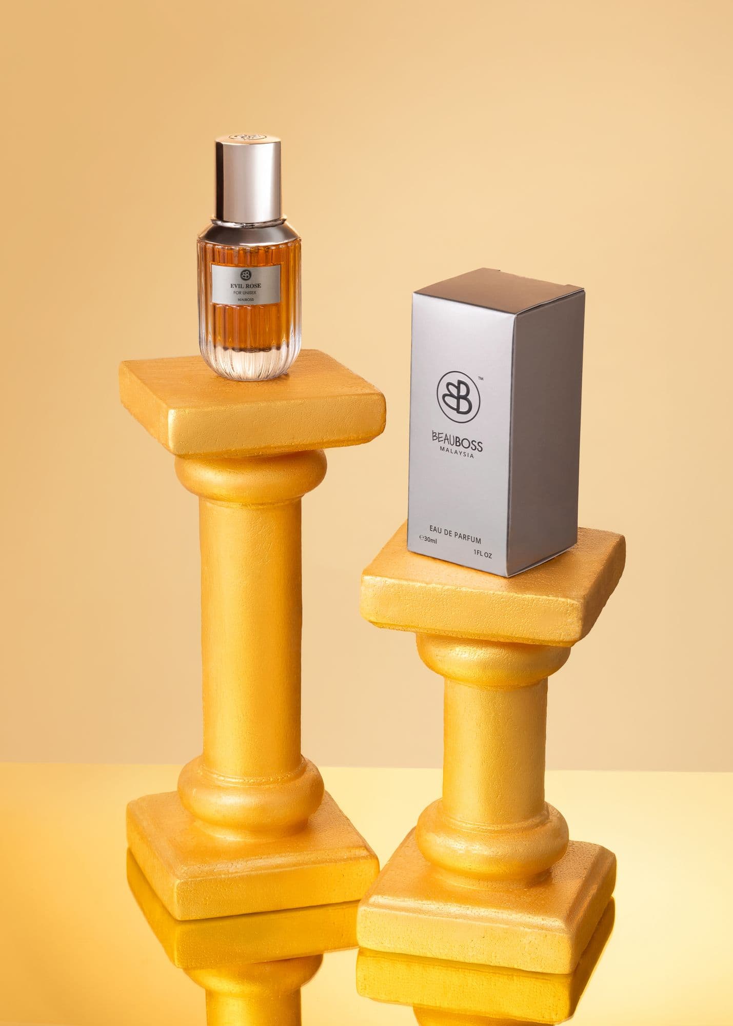 Beauboss perfume bottle and gift box on gold pedestals